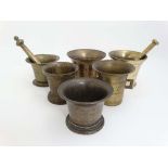 A collection of 6 x 18thC and later brass and bell metal mortars, 2 with pestles. Largest 4 3/4"