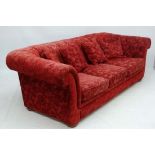 A 20thC button back upholstered  Chesterfield three seat sofa 27 1/2" high x 36" deep x 90" wide