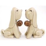 A pair of c1950s Sylvac dogs with barrels , model number 2421, having makers marks to bases. 5''