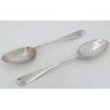 2 18thC Fancy back silver teaspoons with scroll decoration.   The largest approx 4 1/2" long (24g)