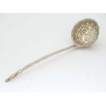 A silver sifter spoon / strawberry caster. Indistinctly  marked. Approx 7" long (28g) CONDITION: