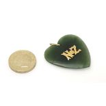 New Zealand souvenir : A green jade pendant of heart shape with gold lettering 'NZ' Appox 1 1/2"