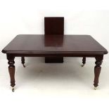 A late 20thC late Victorian style extending mahogany dining table with additional leaf. 44 1/2" wide