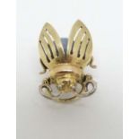 A 14ct gold lapel pin / brooch formed as a stylised bee/bug/ winged insect set with opal to