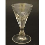 A 19thC trumpet formed pedestal glass with facet cut sides and clear glass foot with ground pontil