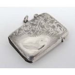 A silver vesta case with engraved decoration. Hallmarked Birmingham 1912  maker William J Holmes