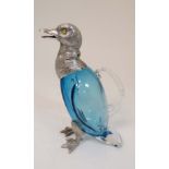 A late 20thC novelty claret jug, formed as a duck with blue glass body and silver plated mounts with