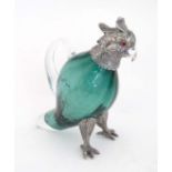 A late 20thC  novelty whiskey noggin / chota peg formed as a parrot with turquoise glass body with