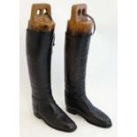 Equestrian: A pair of black leather '' Moss Bros Ltd '' , Covent Garden riding / hunting boots