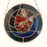 A leaded and stained glass tondo with a fisherman within, 14" diameter. CONDITION: Please Note -  we