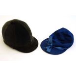 A Mid 20thC traditional black velvet fixed peak riding hat by Herbert Johnson of Bond Street,