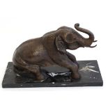 Bronze Sculpture,
An Elephant about to lie down,
On a white flecked black marble base,
15" long x