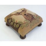 A  tapestry covered upholstered footstool with image of a 10 point Stag to top, with brass stud