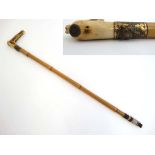 Hunting: A c1874 antler handled bamboo hunting whip with applied mount showing a fox's mask and