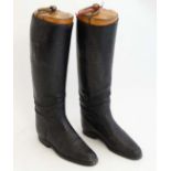 Equestrian: A pair of child's black leather riding / hunting boots and trees. Each numbered