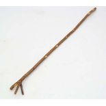 Thumb stick : A hazel shafted hand made stick with Y shaped Thumb piece to top, measuring  52 1/2"