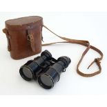 A pair of ' Marque iris de Paris '"sporting" racing binoculars with shaped eye pieces together