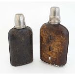 2 old hip flask, the glass flasks with full leather covering and  tot cup to top. The tallest 7"
