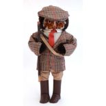 A novelty owl dressed in tweed ratcatcher , flatcap and wellington boots , carrying a hazel stick