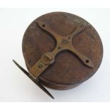 Antique Fishing:  An Edwardian mahogany and brass star back 4"Salmon reel with twin bone handles.