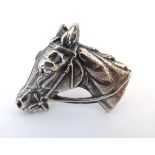 A silver plate scarf ring / napkin ring with horse head decoration. Approx 1 ¾” wide 
 CONDITION: