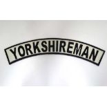 A cast "Yorkshireman" sign