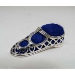 A filigree decorated shoe formed pin cushion  CONDITION: Please Note -  we do not make reference