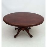 A Victorian oval mahogany Loo table standing on a four foot base 54" long x 42" wide  CONDITION: