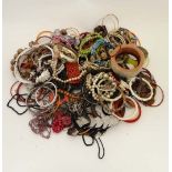 A very large quantity of assorted costume jewellery to include bracelets, necklaces etc.