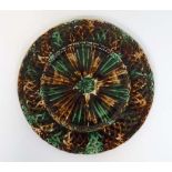 A Scottish Alloa Pottery Majolica moulded basket weave plate decorated in mottled tortoiseshell