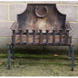 A Wrought iron Fire Grate of rivetted construction, 26 1/2" high , standing 13" high x 16" deep with