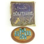 A Chad Valley solitaire set with wooden board and 32  marbles mainly in turquoise  in original box