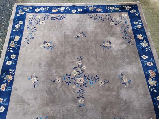 Rug / Carpet : A Chinese woollen carpet with floral decoration,  blue banded border and mushroom - Image 3 of 7