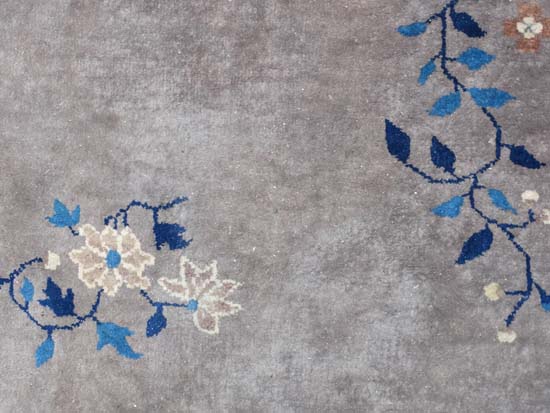 Rug / Carpet : A Chinese woollen carpet with floral decoration,  blue banded border and mushroom - Image 4 of 7