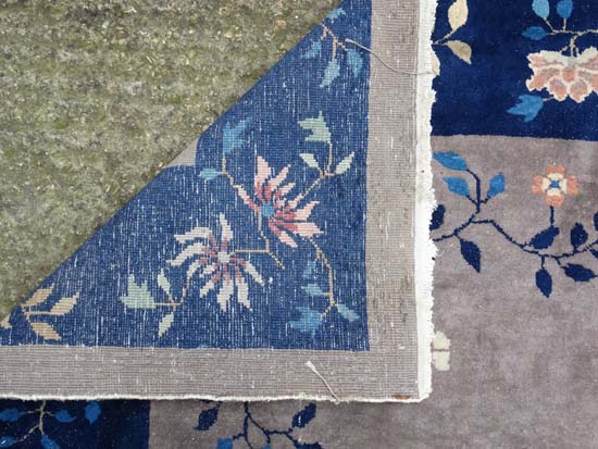 Rug / Carpet : A Chinese woollen carpet with floral decoration,  blue banded border and mushroom - Image 2 of 7