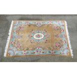 Rug / Carpet :a Chinese woollen carpet with floral decoration, turquoise border , oval central