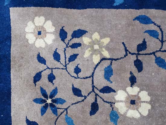 Rug / Carpet : A Chinese woollen carpet with floral decoration,  blue banded border and mushroom - Image 5 of 7