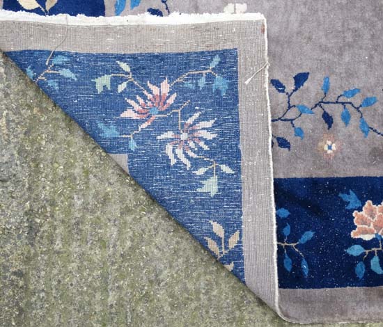 Rug / Carpet : A Chinese woollen carpet with floral decoration,  blue banded border and mushroom - Image 6 of 7