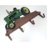 Coat hook : 4 cast coat hooks surmounted by a "Tractor"  CONDITION: Please Note -  we do not make