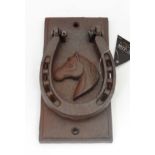 A cast metal "Horseshoe" door knocker CONDITION: Please Note -  we do not make reference to the