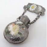 A white metal and silver plated scent bottle holder with  brooch attachment and enamel floral