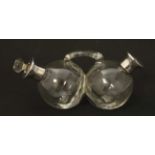 A twin glass oil and vinegar bottle with silver collars. Hallmarked 1935 with Jubilee mark. the