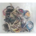 A very large quantity of assorted costume jewellery to include bracelets, necklaces etc CONDITION: