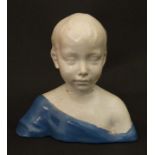 An Italian Majolica style bust of a boy in the manner of Cantagalli after the original by