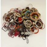 A very large quantity of assorted costume jewellery to include bracelets, necklaces etc.