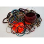 A very large quantity of assorted costume jewellery to include bracelets, necklaces etc CONDITION: