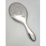 Silver backed hand mirror  CONDITION: Please Note -  we do not make reference to the condition of
