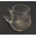 A 20thC German glass tankard with acid etched decoration depicting a stag within a wood 4" high