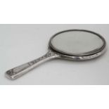 A small Continental white metal hand mirror approx 8 3/4" long  CONDITION: Please Note -  we do