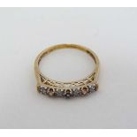 A 9ct gold ring set with diamonds and other coloured stones in a linear setting
 CONDITION: Please